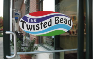 The Twisted Bead & Rock Shop door and logo.