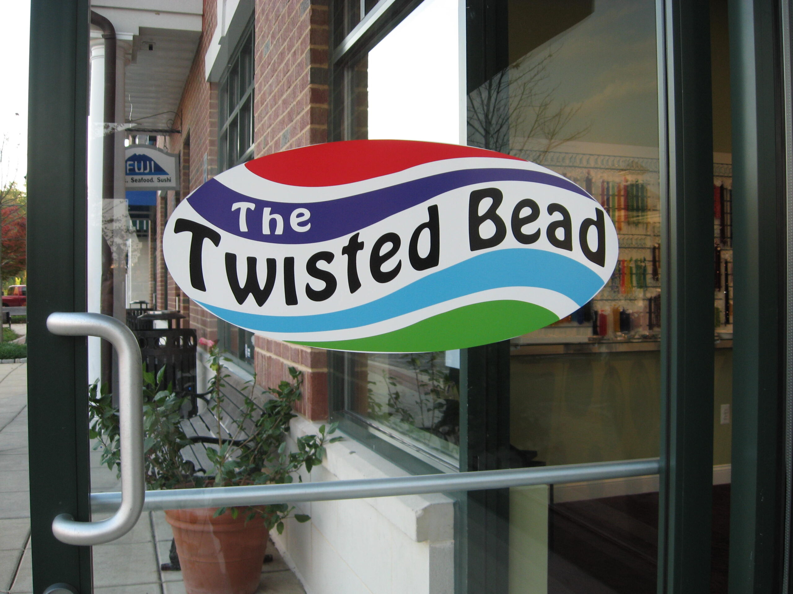 The Twisted Bead & Rock Shop door and logo.