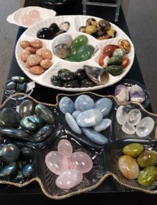 assorted palm stones available at the twisted bead & rock shop