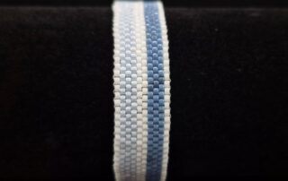 Peyote stitch bracelet, blue and white front side.